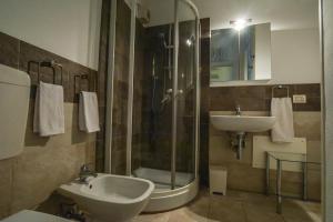 a bathroom with a shower and a sink at Villa Norma in Milano Marittima +112 photos