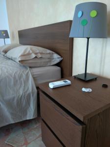 A bed or beds in a room at Appartamento Il Mandorlo - Custonaci