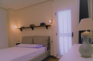 A bed or beds in a room at Vuemme 97
