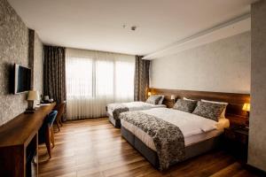 Postel nebo postele na pokoji v ubytování Life Point Hotel + 37 fotografií