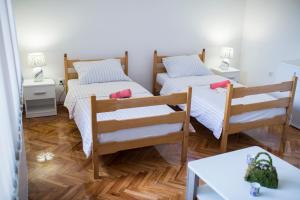 Posteľ alebo postele v izbe v ubytovaní Apartman Nisa