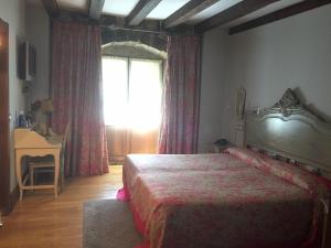 Postel nebo postele na pokoji v ubytování Posada Real Torre Berrueza