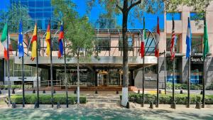 a group of flags in front of a building at Barceló Mexico Reforma in Mexico City
