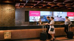 a group of people waiting at a counter at an airport at Barceló Mexico Reforma in Mexico City