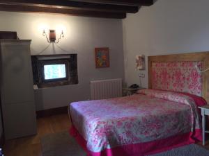 Postel nebo postele na pokoji v ubytování Posada Real Torre Berrueza
