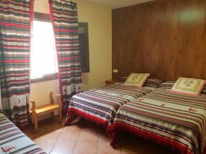 Postel nebo postele na pokoji v ubytování Hostal Pampaneira