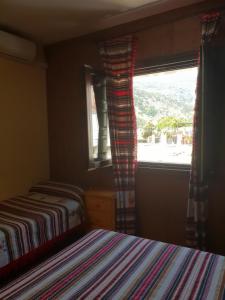 Postel nebo postele na pokoji v ubytování Hostal Pampaneira