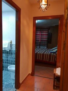 Postel nebo postele na pokoji v ubytování Hostal Pampaneira