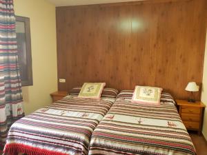 Postel nebo postele na pokoji v ubytování Hostal Pampaneira
