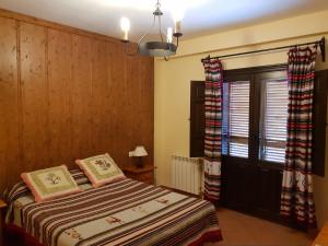Postel nebo postele na pokoji v ubytování Hostal Pampaneira