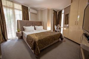 Llit o llits en una habitació de Hotel Perfect
