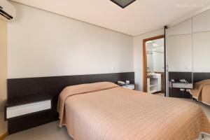 Postel nebo postele na pokoji v ubytování Aquaria Natal Hotel