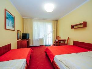 Кровать или кровати в номере Wachta Pobierowo