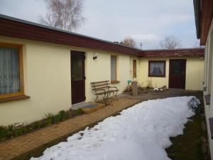 a pile of snow in front of a house at Haus Frohsinn in Ueckeritz