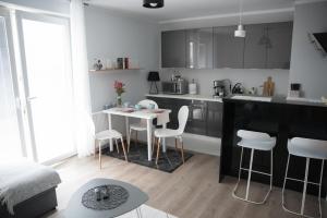 Kuchyň nebo kuchyňský kout v ubytování Apartament Soft 11