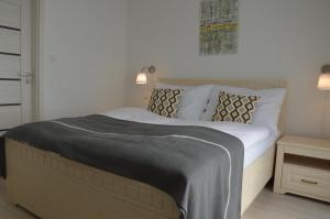 Postel nebo postele na pokoji v ubytování Apartmány Charlie