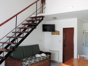 TV a/nebo společenská místnost v ubytování IRUPÉ APART HOTEL
