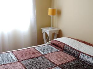 Postel nebo postele na pokoji v ubytování IRUPÉ APART HOTEL