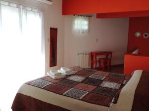 Postel nebo postele na pokoji v ubytování IRUPÉ APART HOTEL