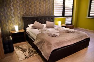Łóżko lub łóżka w pokoju w obiekcie Hotel Forum Fitness Spa & Wellness