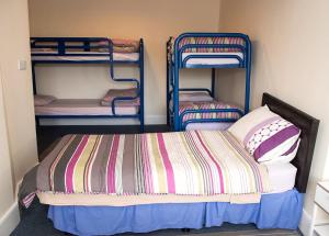 Postel nebo postele na pokoji v ubytování Sive Budget Accommodation