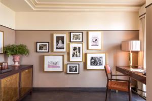 a room with a desk and pictures on the wall at Sunset Tower Hotel in Los Angeles