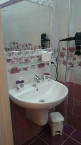 a bathroom with a sink and a toilet at La dimora di Vituccio B&B in Avetrana +31 photos