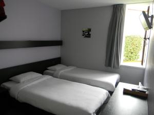 Class-Hôtelにあるベッド