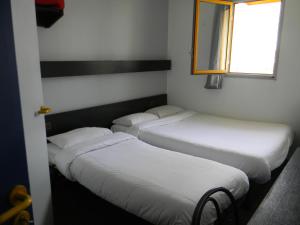 Postel nebo postele na pokoji v ubytování Class-Hôtel