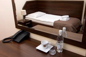 Łóżko lub łóżka w pokoju w obiekcie Hotel Forum Fitness Spa & Wellness