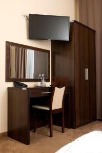 Telewizja i/lub zestaw kina domowego w obiekcie Hotel Forum Fitness Spa & Wellness