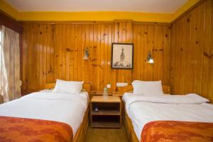 Ein Bett oder Betten in einem Zimmer der Unterkunft Langtang View Nagarkot Bed and Breakfast
