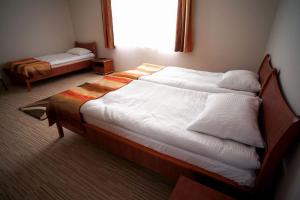 Postel nebo postele na pokoji v ubytování Borka Apartman