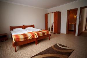 Postel nebo postele na pokoji v ubytování Borka Apartman
