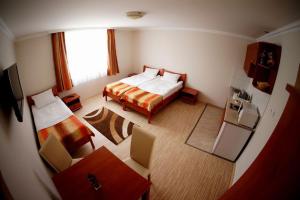 Postel nebo postele na pokoji v ubytování Borka Apartman