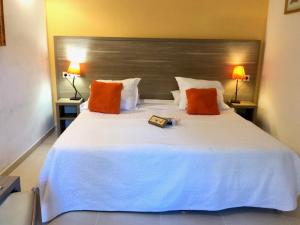 מיטה או מיטות בחדר ב-Le Mas des Ecureuils