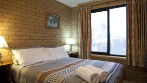 Ένα ή περισσότερα κρεβάτια σε δωμάτιο στο St Trinian's 3a