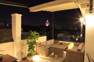 a balcony with a view of a city at night at Art Nouveau Pera in Istanbul