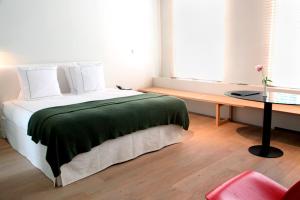 Postel nebo postele na pokoji v ubytování Hotel Julien