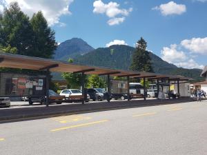 buses parked at a bus stop at Casa Alpina Dobbiaco in Dobbiaco