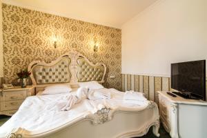 Łóżko lub łóżka w pokoju w obiekcie Pałac Margot Nature&SPA
