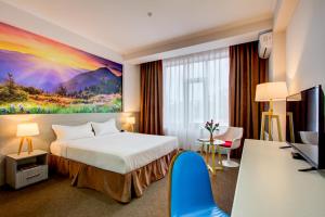 Postel nebo postele na pokoji v ubytování Hotel Bridges Bishkek