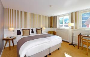 Letto o letti in una camera di Waldhotel Stuttgart