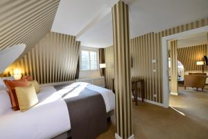 Letto o letti in una camera di Waldhotel Stuttgart