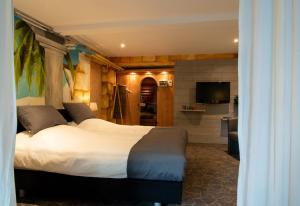 Een bed of bedden in een kamer bij B&B Bed & Sauna