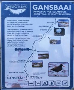 a sign with a picture of a bird on a trail at Marine 5 Boutique Hotel in Gansbaai