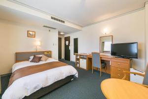 Postel nebo postele na pokoji v ubytování Hotel Miyahira 