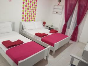A bed or beds in a room at Drouga's Studios & Suites Astypalaia Greece