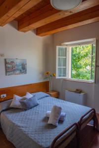En eller flere senge i et værelse på Tenuta Villa Colle Sereno