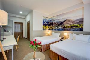 Postel nebo postele na pokoji v ubytování Hotel Bridges Bishkek